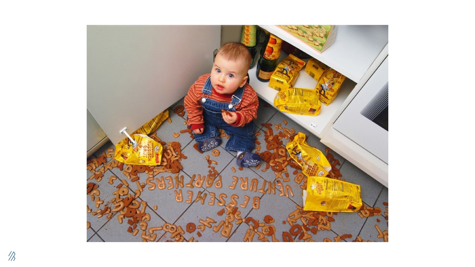 Picture of baby with Bessemer Venture Partners written out in cookies. 