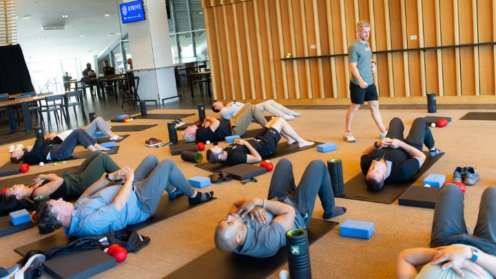 photo of people doing sit-ups on floor